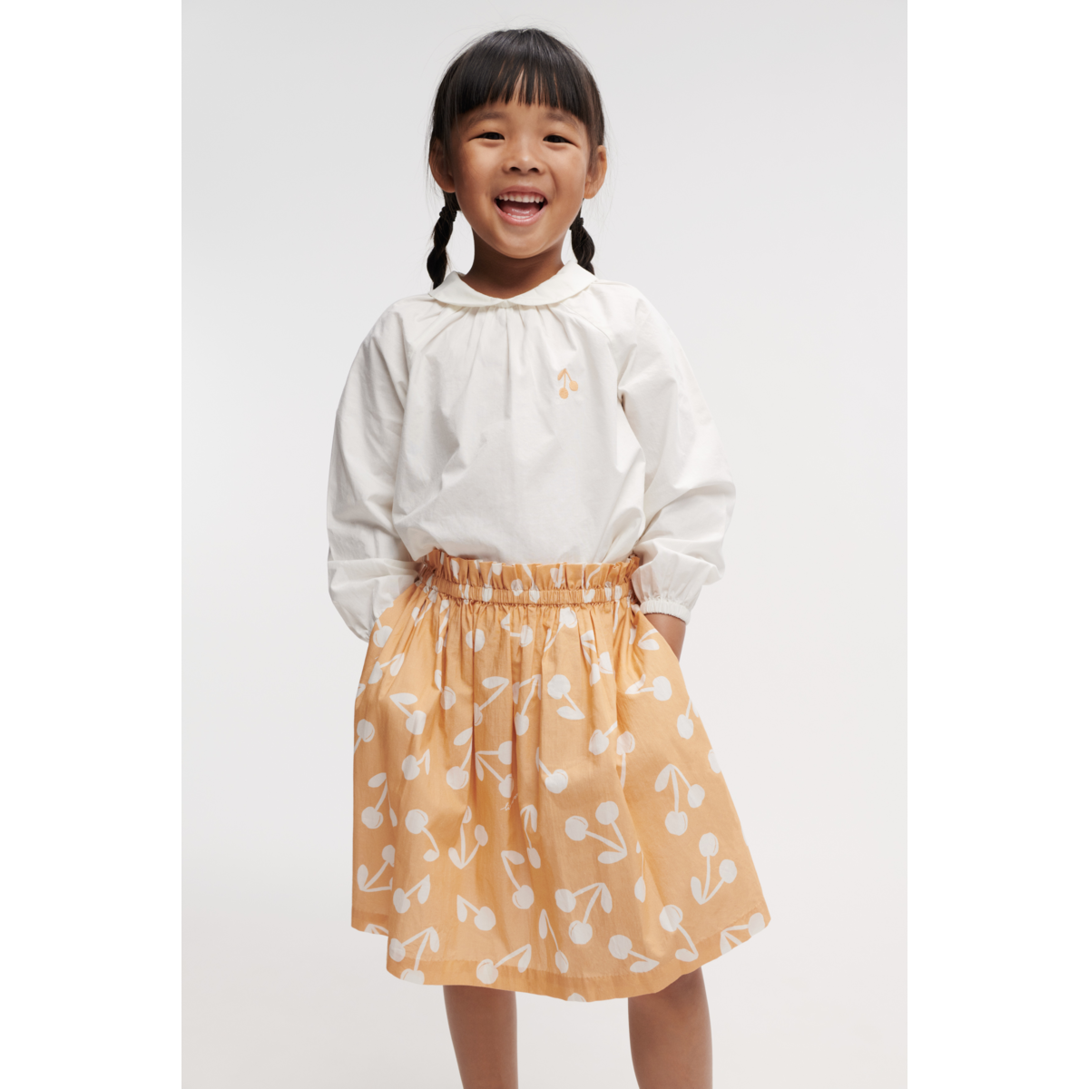 Jupe évasée en coton biologique à imprimé floral abricot léger avec poches latérales pour l'été et les occasions spéciales